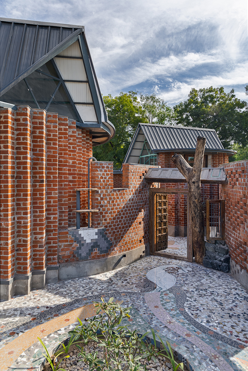 curved brick patterned walls frame farmhouse by manoj patel in india