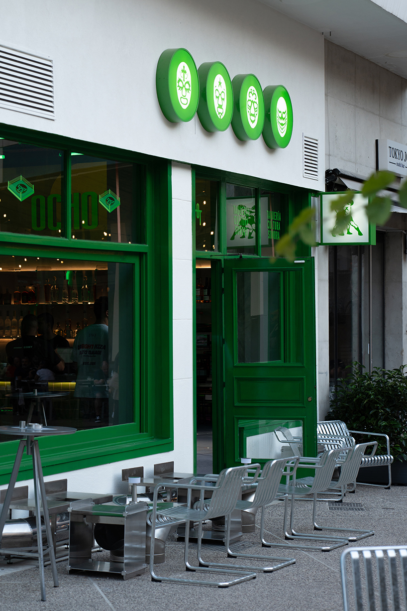 studiomateriality translates lucha libre into green-lit, stainless-steel bar in athens - 1