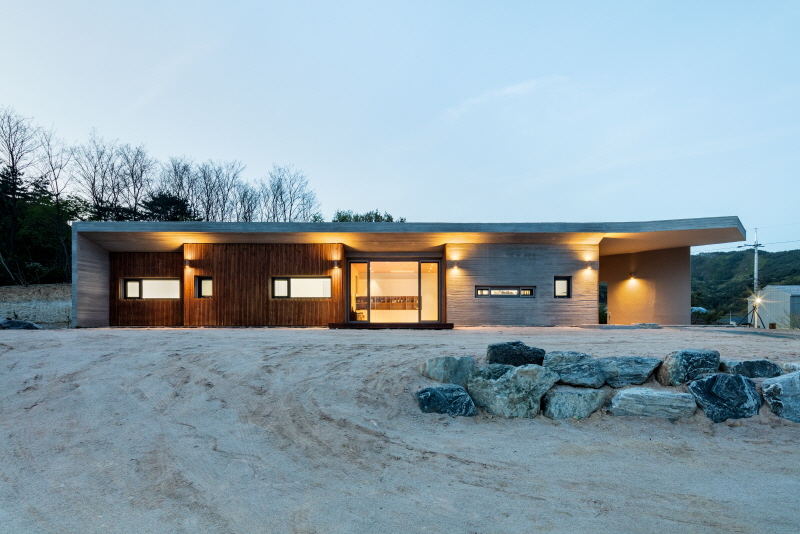 the apple farm house designed by 2m2 architects is inspired by its surrounding natural scenery