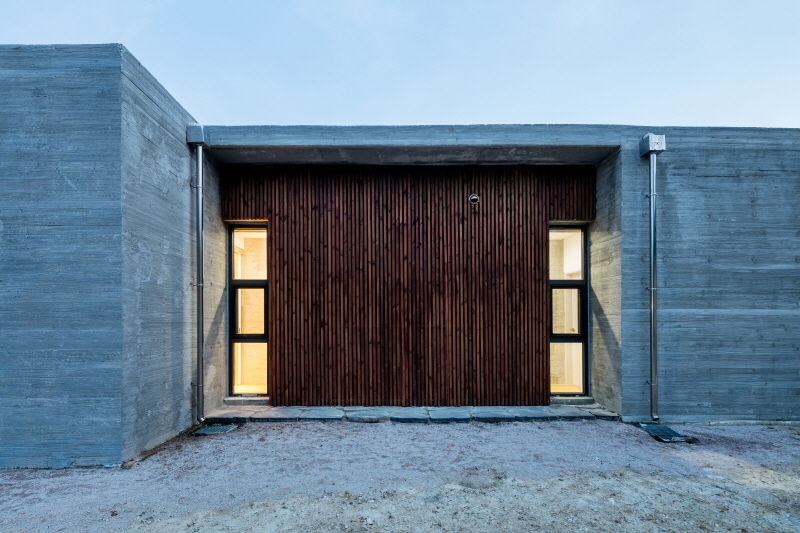 the apple farm house designed by 2m2 architects is inspired by its surrounding natural scenery