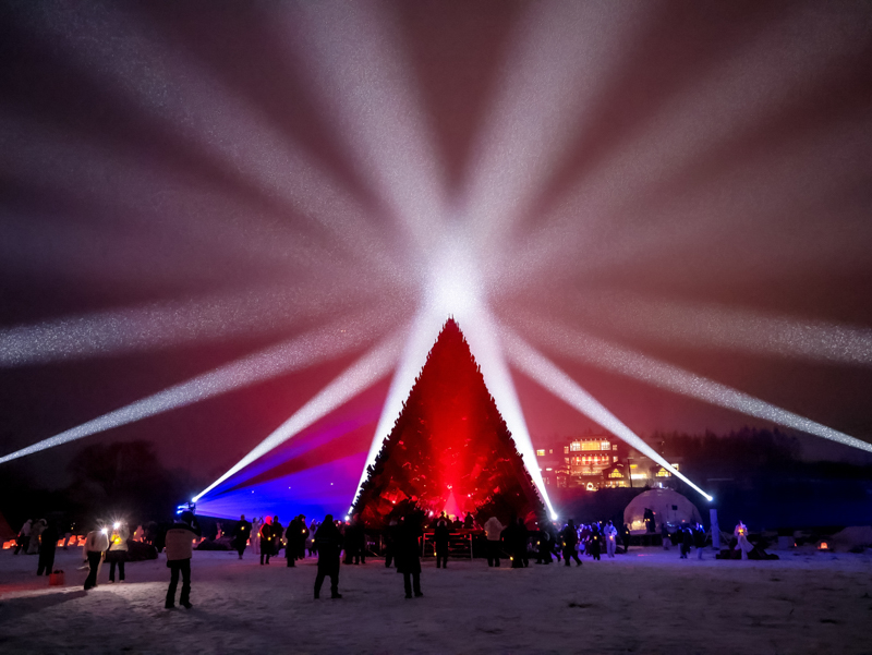 reflective red chamber emerges from prism mountain shelter’s charred wood shell
