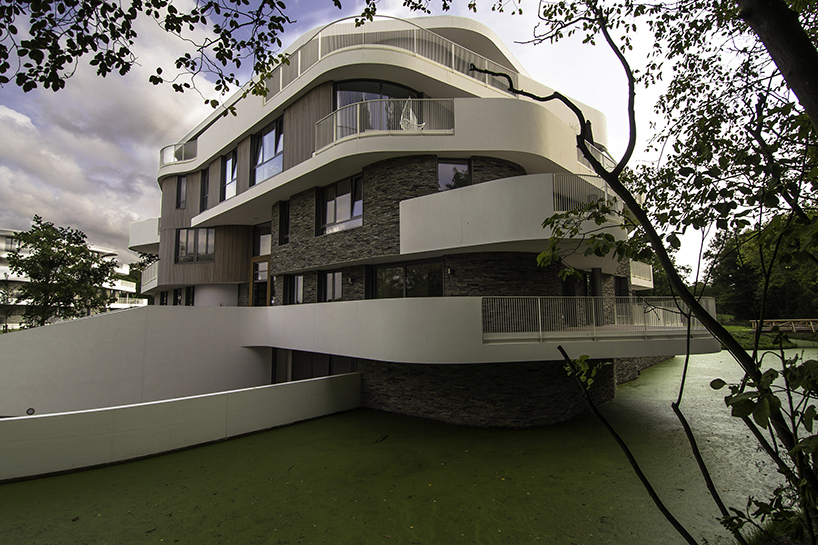 BREIN architects' organic-shaped villas are set in a park-like site in the netherlands