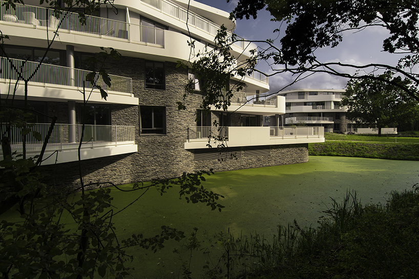 BREIN architects' organic-shaped villas are set in a park-like site in the netherlands