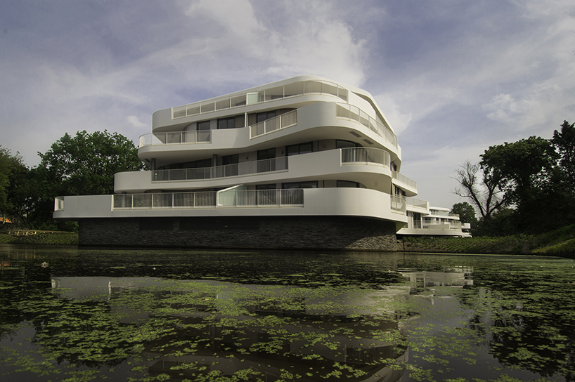 BREIN architects' organic-shaped villas are set in a park-like site in the netherlands