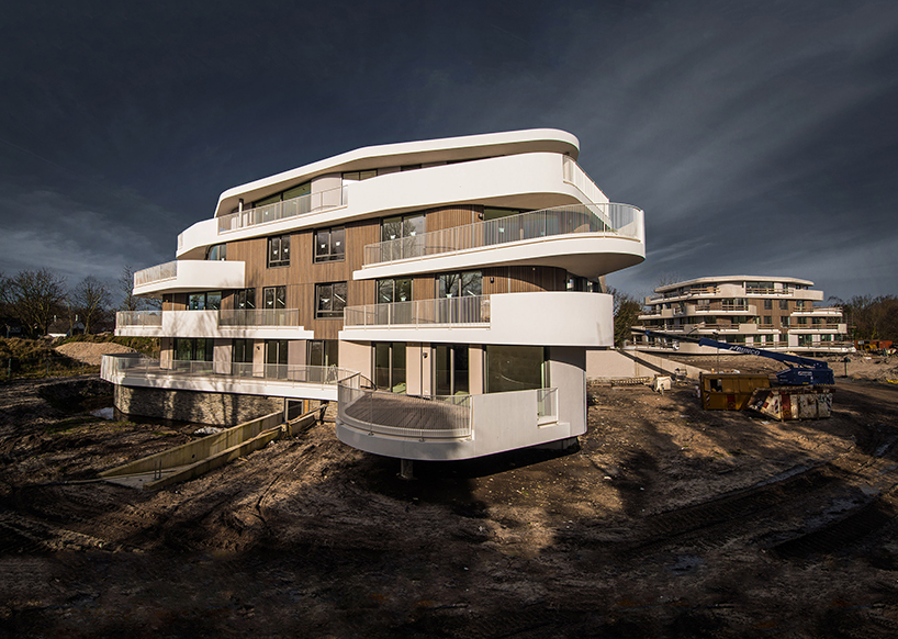 BREIN architects' organic-shaped villas are set in a park-like site in the netherlands