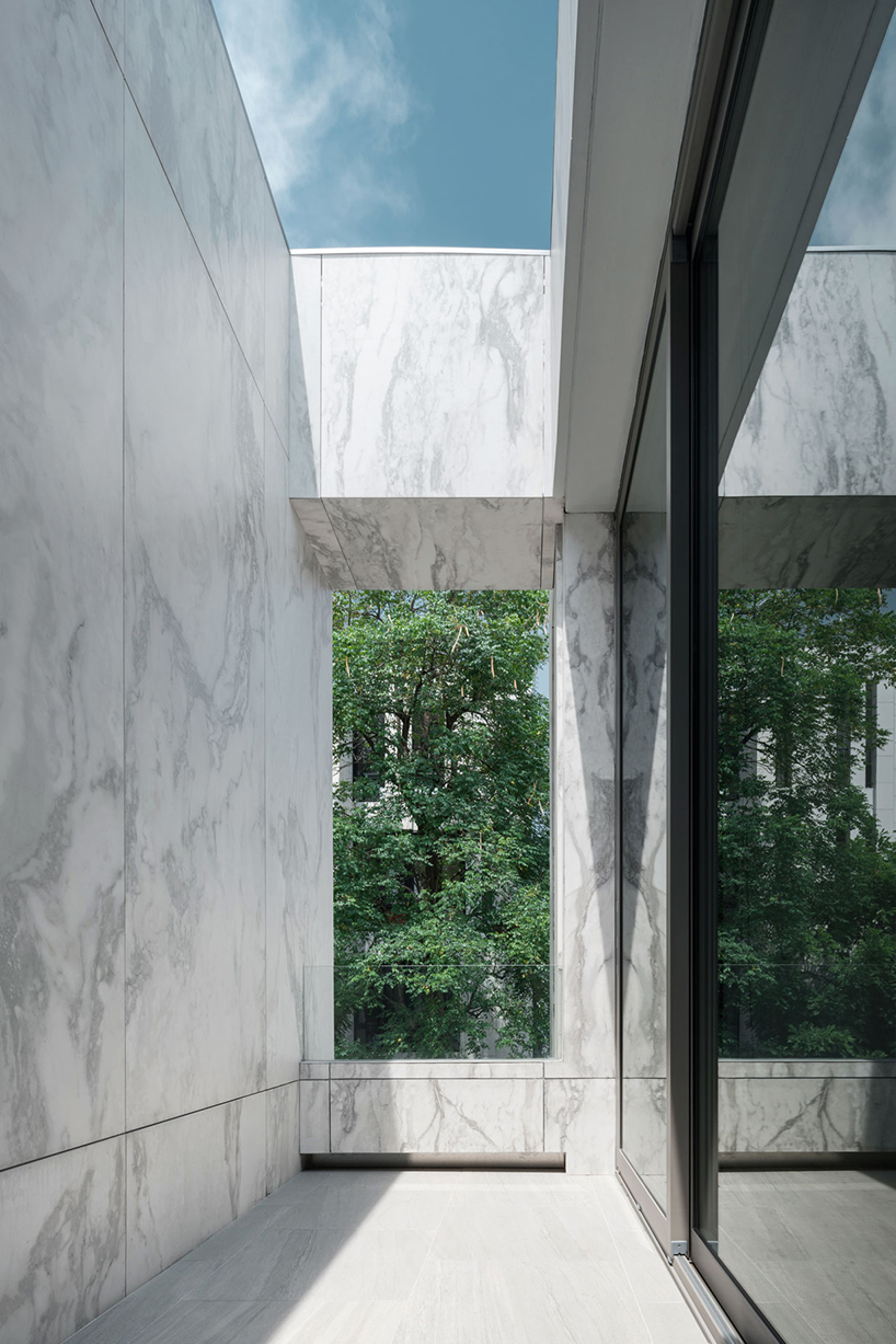 openbox intertwines architecture and landscape with marble house in thailand