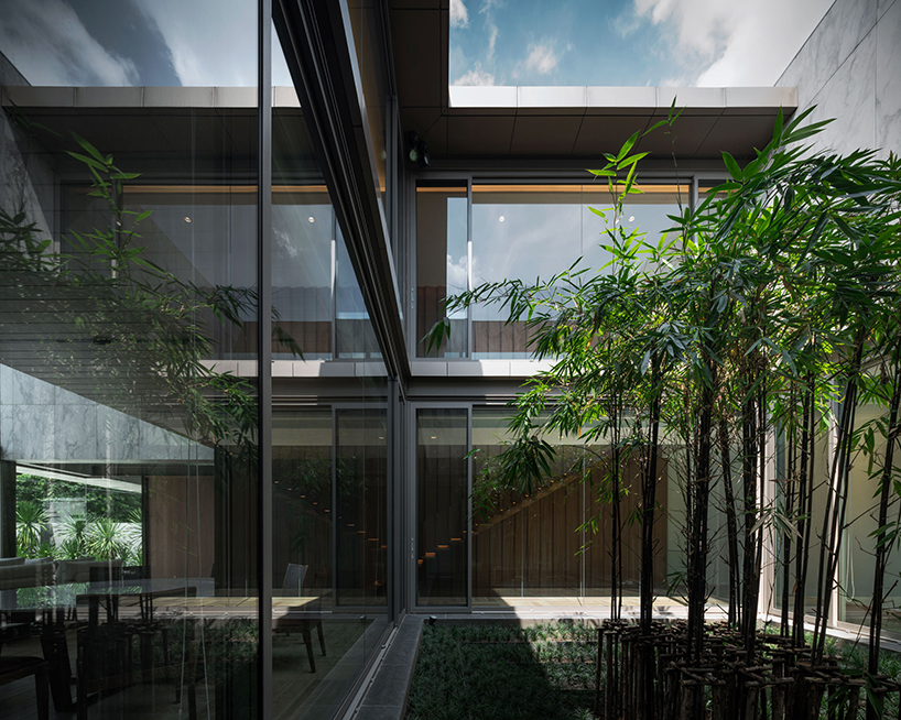 openbox intertwines architecture and landscape with marble house in thailand