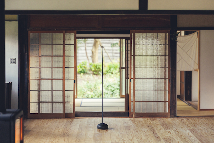 spindle coat rack by koichi futatsumata gently sways when garments are hung on it