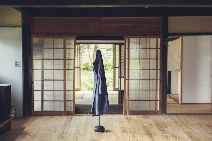 spindle coat rack by koichi futatsumata gently sways when garments are hung on it