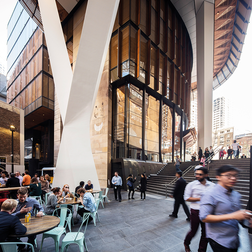 fjmt studio's kinetic tower of wood transcends grey skyscrapers in sydney