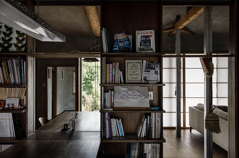 1110 designs a house and office in osaka with wood panels and warm grey