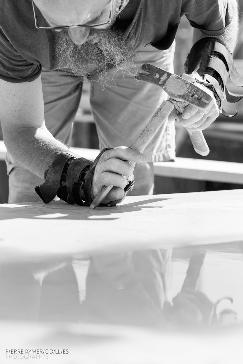 jean couvreur sculpts white concrete bench as an urban oasis