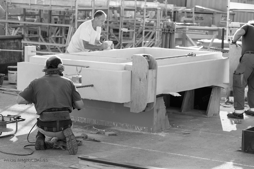 jean couvreur sculpts white concrete bench as an urban oasis
