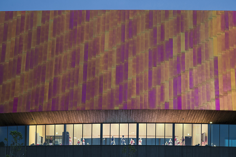 faulknerbrowns' copper-enveloped sports campus in the hague embodies principle of motion