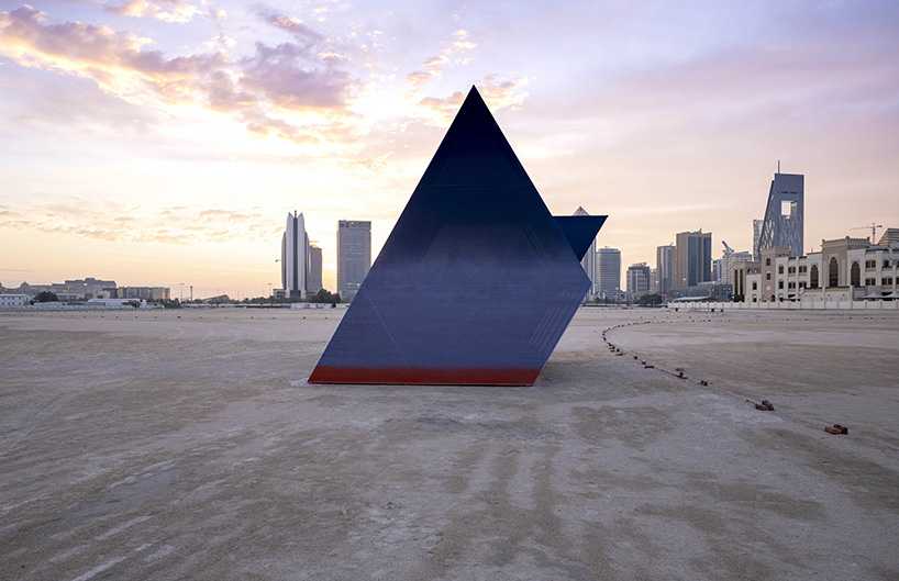 colorful angular volumes shape resting bleachers for cricket players in qatar