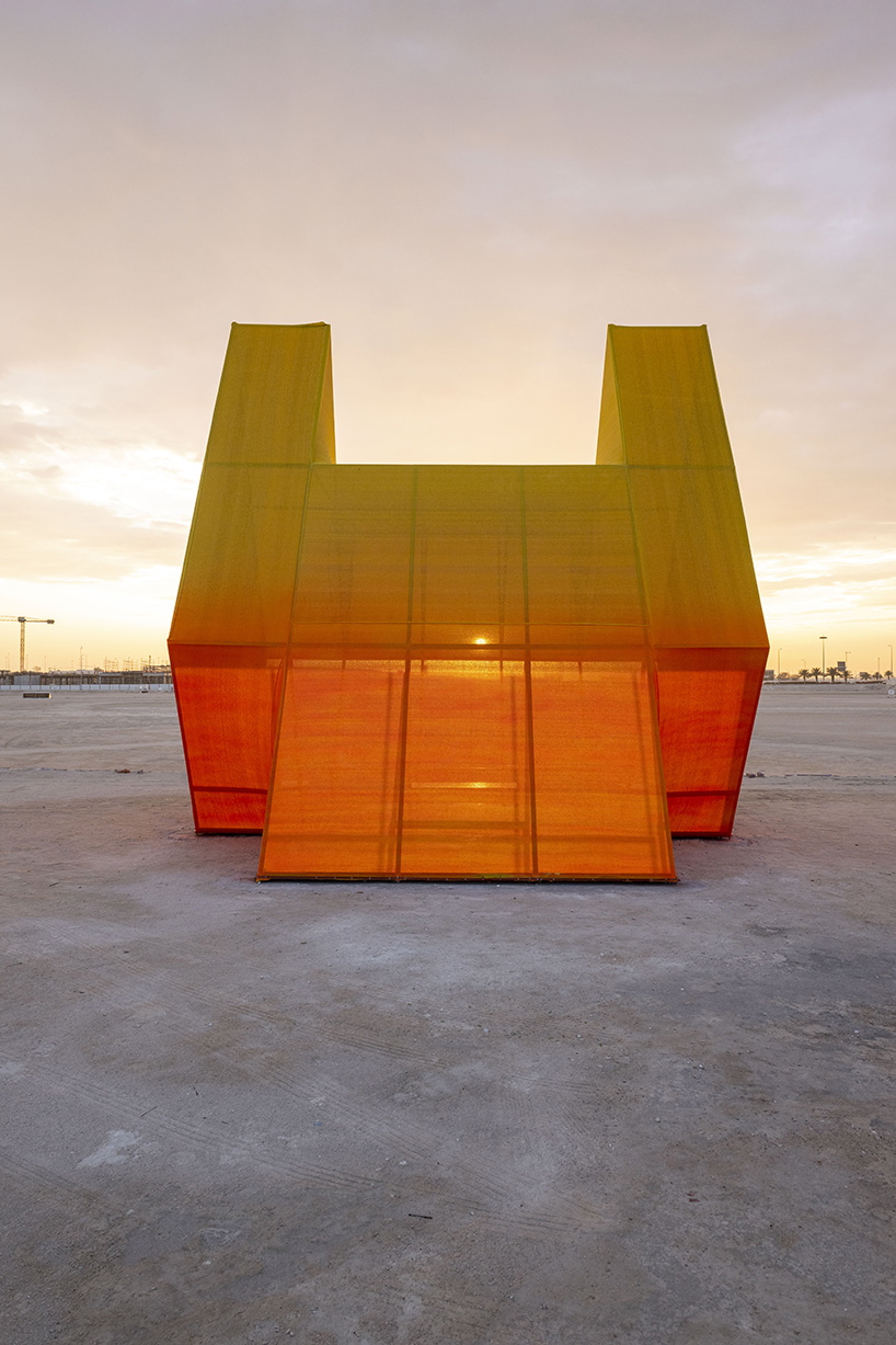 colorful angular volumes shape resting bleachers for cricket players in qatar