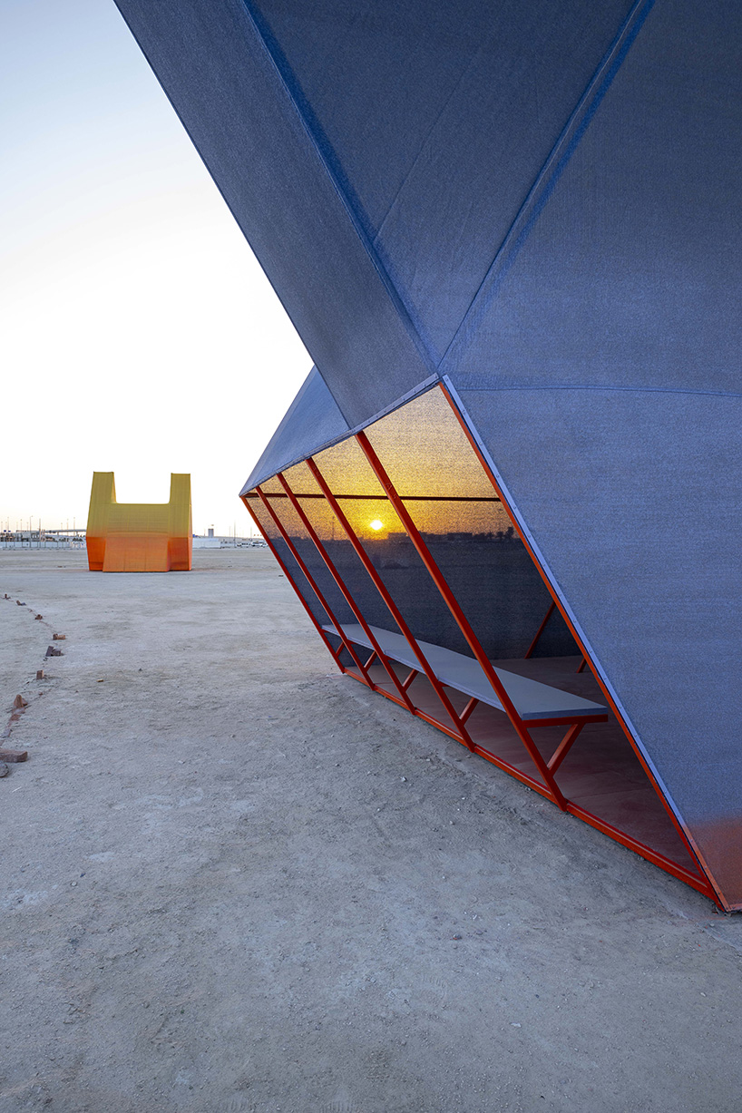 colorful angular volumes shape resting bleachers for cricket players in qatar