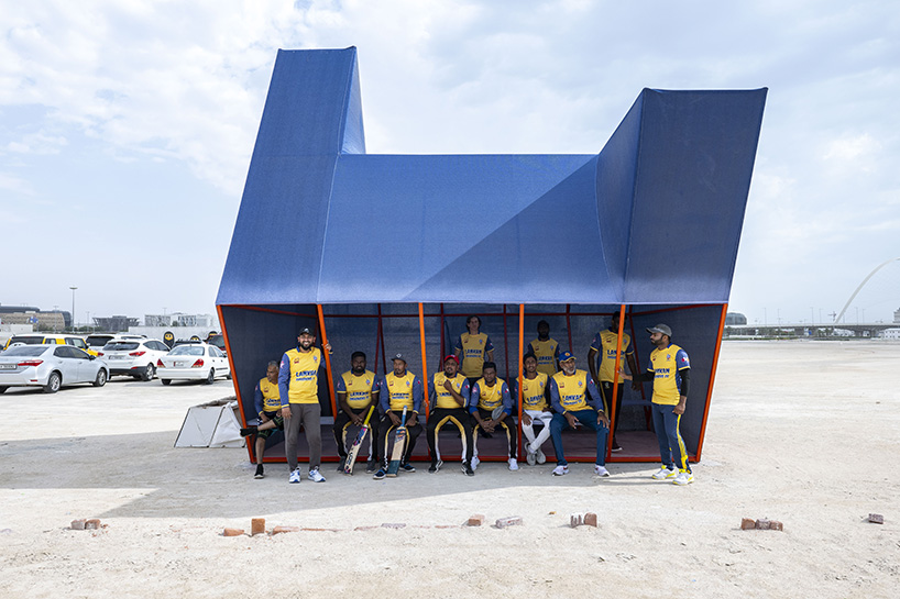 colorful angular volumes shape resting bleachers for cricket players in qatar