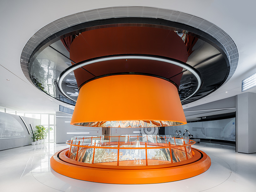 wutopia lab's luminous showroom with sweeping orange peaks echoes chinese mountainscape