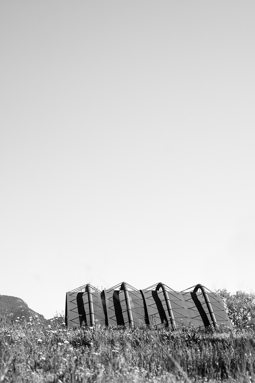 miquel subiras' organic-shaped cultural center in spain mimics its surrounding nature