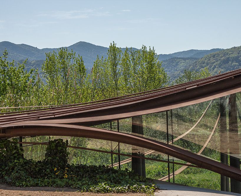 miquel subiras' organic-shaped cultural center in spain mimics its surrounding nature