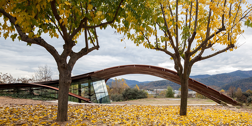 miquel subiras' organic-shaped cultural center in spain mimics its surrounding nature