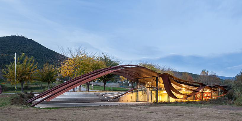 miquel subiras' organic-shaped cultural center in spain mimics its surrounding nature