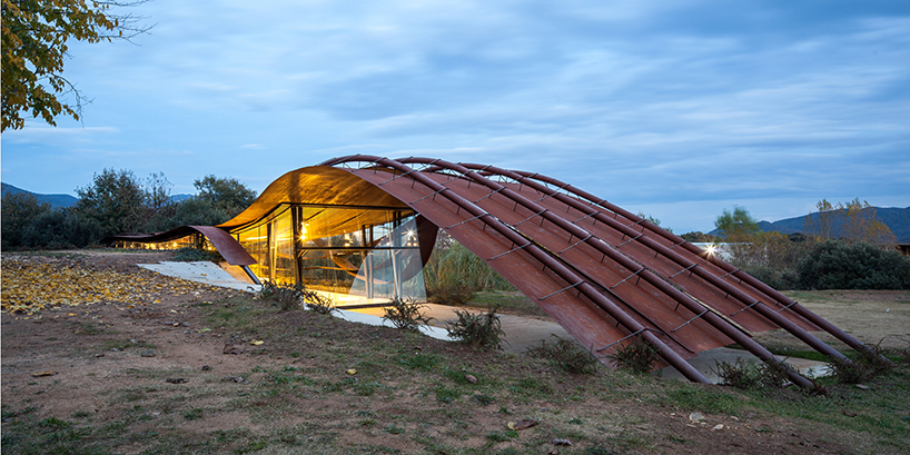 miquel subiras' organic-shaped cultural center in spain mimics its surrounding nature