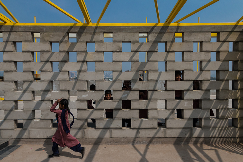 designaware presents a school carved from a cliff in the heritage precinct of golconda