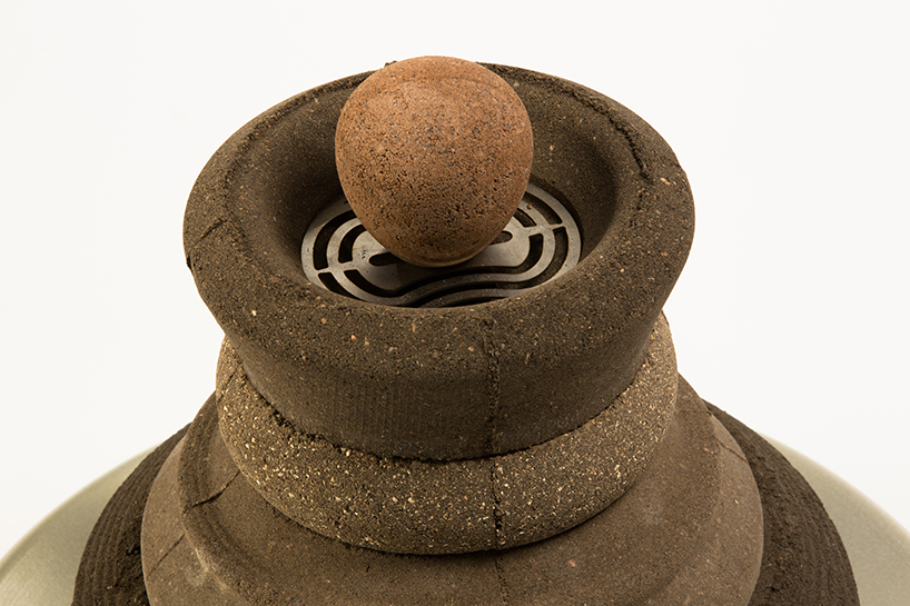 shahar kedem's stove questions the distance between the urban man and earth's soil