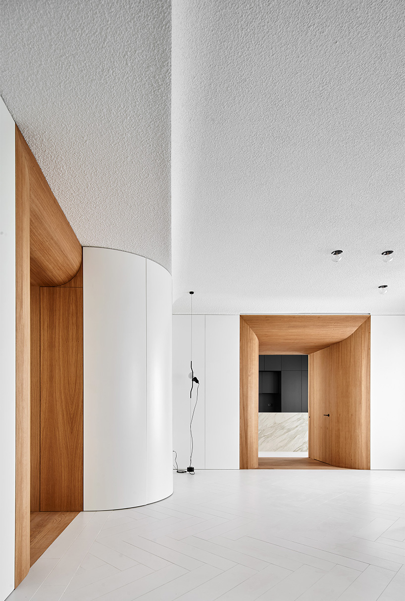 wooden curved casings frame domestic scenes within centuries-old home in madrid