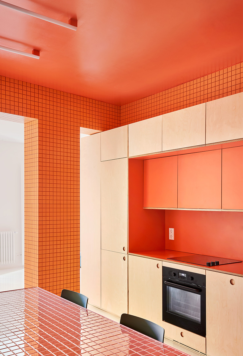 three vibrant tiled blocks infuse pops of color into tiny madrid apartment