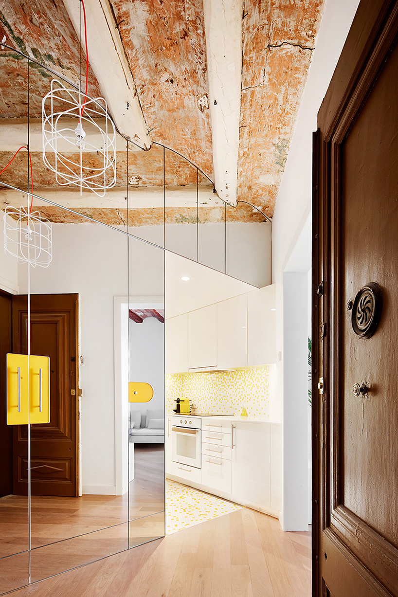 miel arquitectos refurbishes traditional spanish house into a contemporary mirror-clad apartment