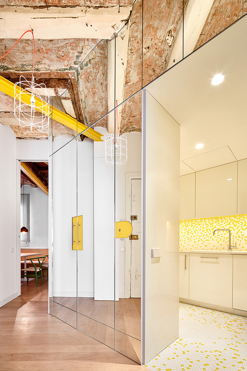 miel arquitectos refurbishes traditional spanish house into a contemporary mirror-clad apartment