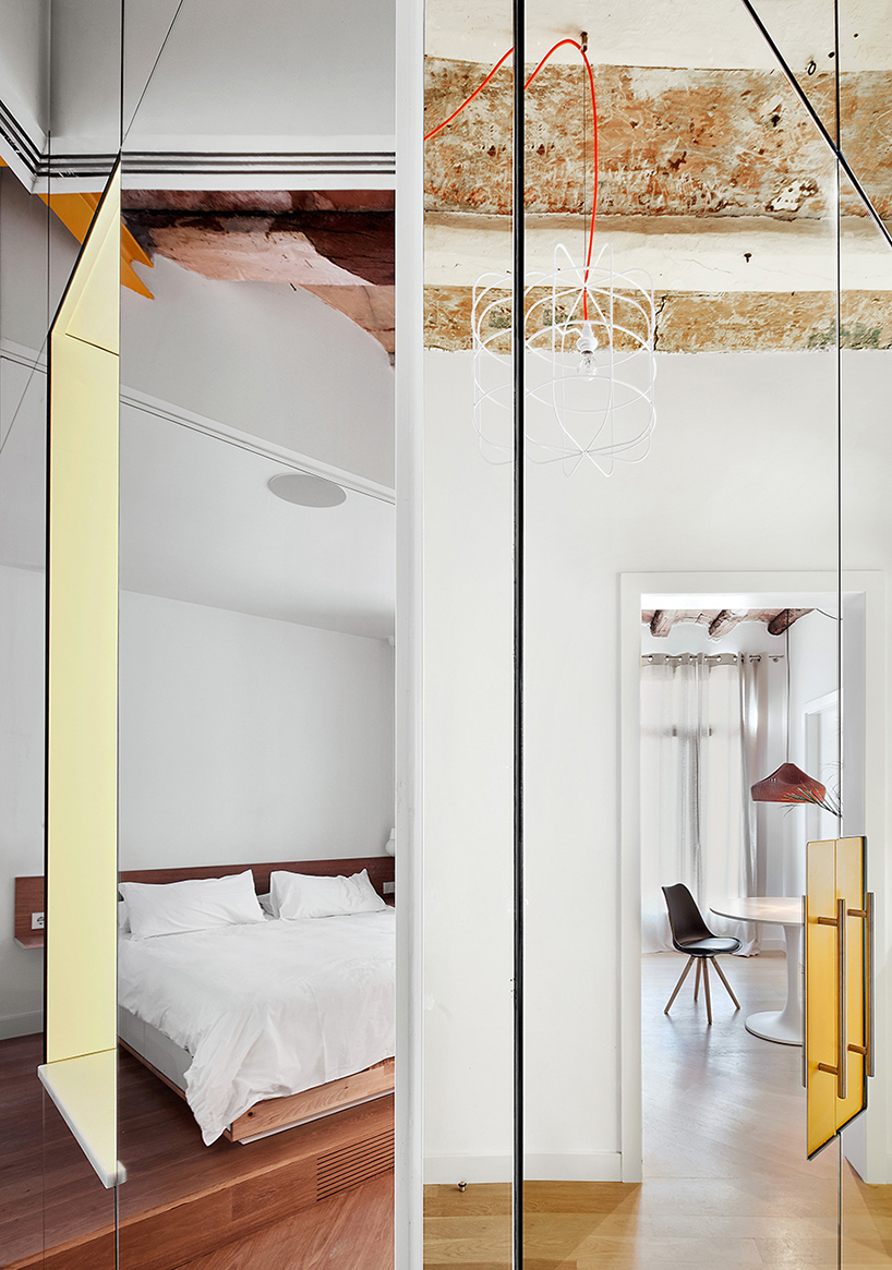 miel arquitectos refurbishes traditional spanish house into a contemporary mirror-clad apartment