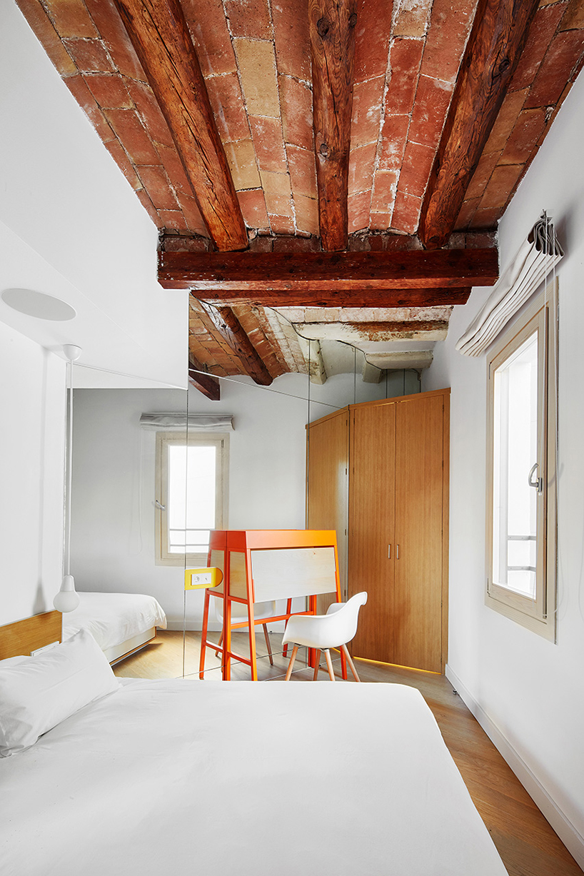 miel arquitectos refurbishes traditional spanish house into a contemporary mirror-clad apartment