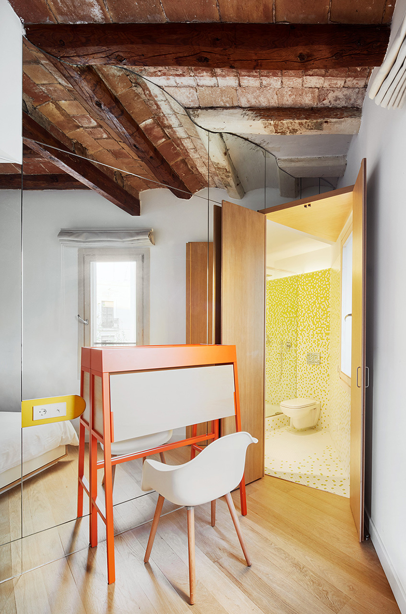 miel arquitectos refurbishes traditional spanish house into a contemporary mirror-clad apartment