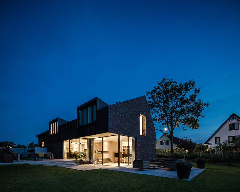EVA designs a copper roofed contemporary house in a dutch ribbon development