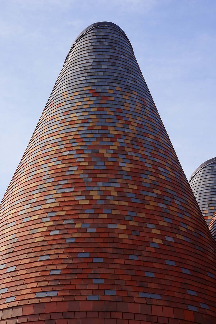 acme creates a contemporary oast house amid the rolling landscape of kent, england designboom