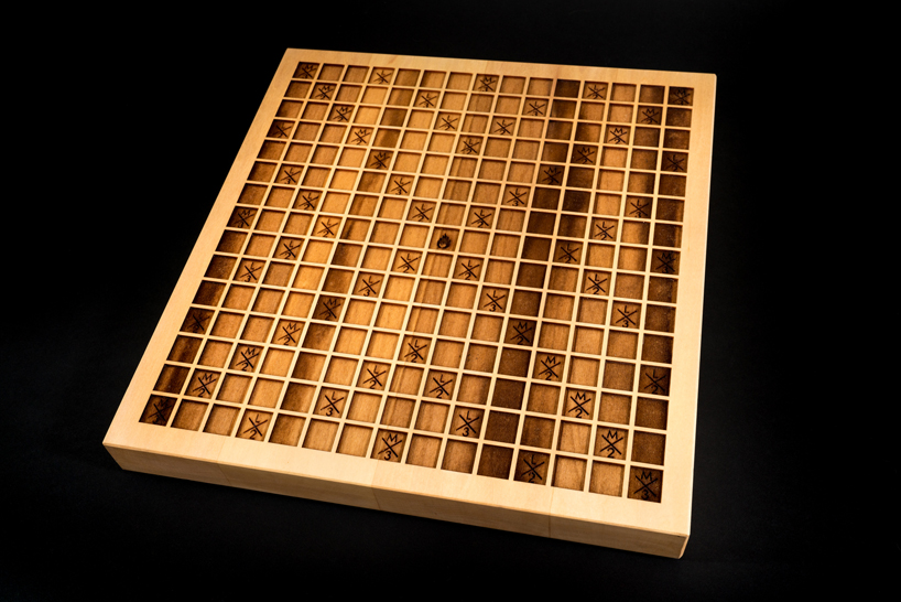 emmanuel laflamme develops a scrabble edition using company logos on wooden tiles