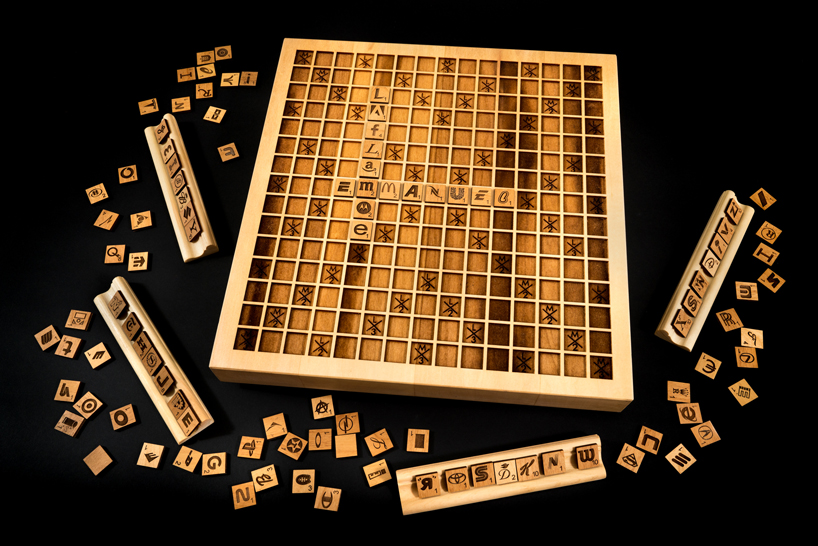 emmanuel laflamme develops a scrabble edition using company logos on wooden tiles