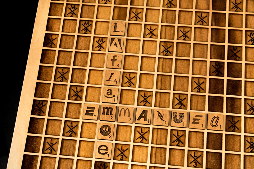 emmanuel laflamme develops a scrabble edition using company logos on wooden tiles