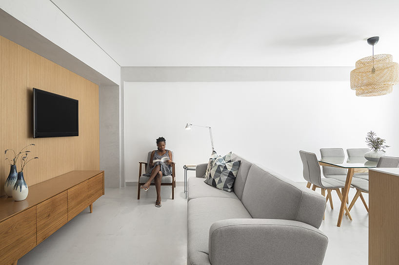 paulo moreira creates a contemporary living space in 1980s residential building