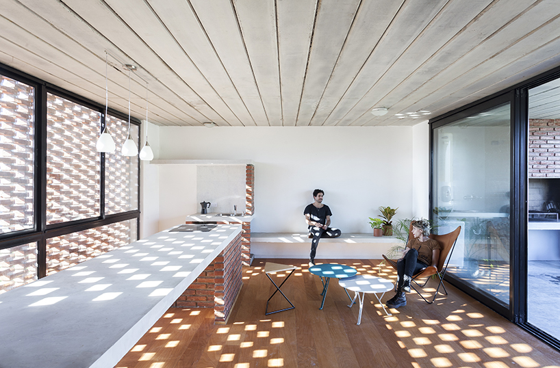 estudio papa uses brick and local techniques to integrate casa TR to buenos aires' urban sprawl