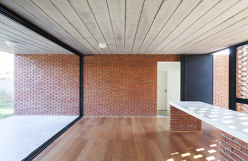 estudio papa uses brick and local techniques to integrate casa TR to buenos aires' urban sprawl
