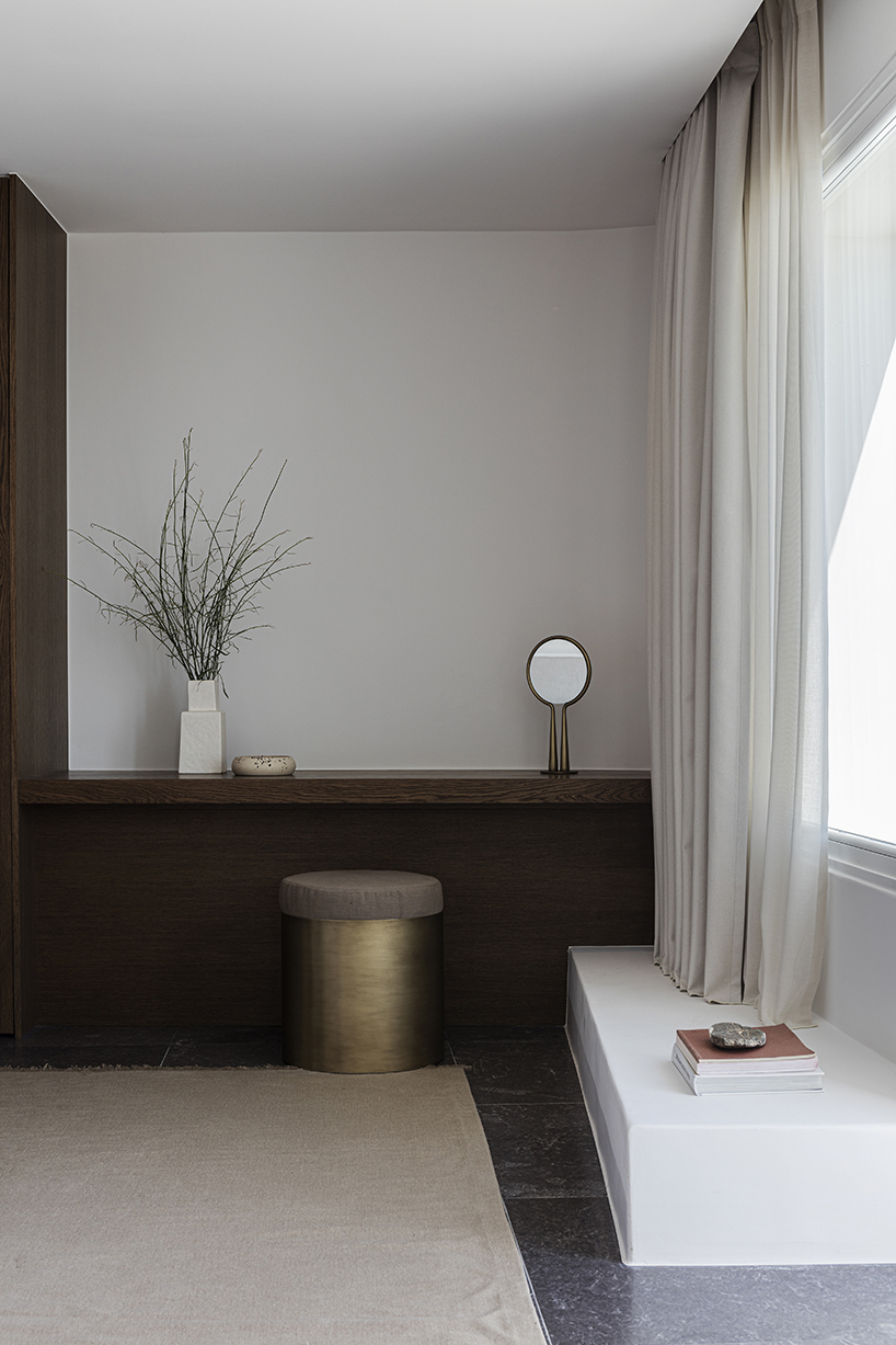 shaped like cubic prisms, kapsimalis architects' hotel rooms echo cave houses in santorini