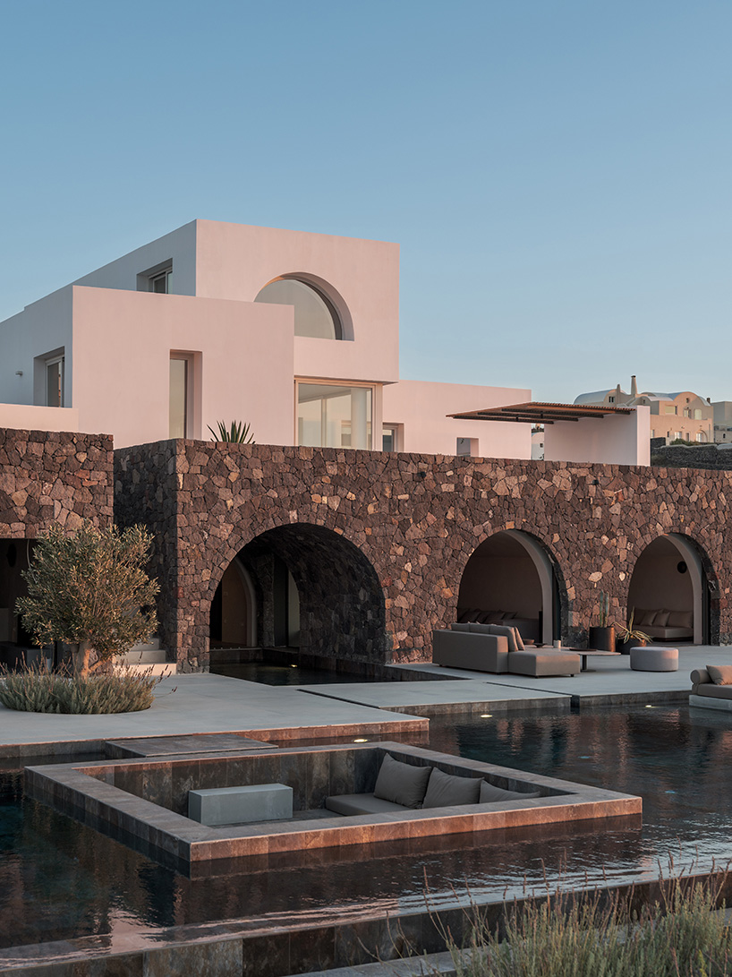 house in oia by kapsimalis architects embeds white prisms along greek volcanic landscape