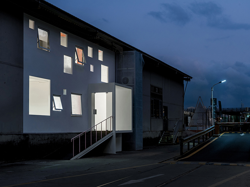 layered transparent walls transform former railway warehouse in shenzhen - 12