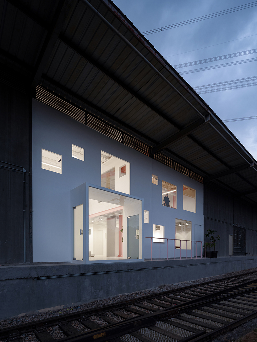 layered transparent walls transform former railway warehouse in shenzhen - 11