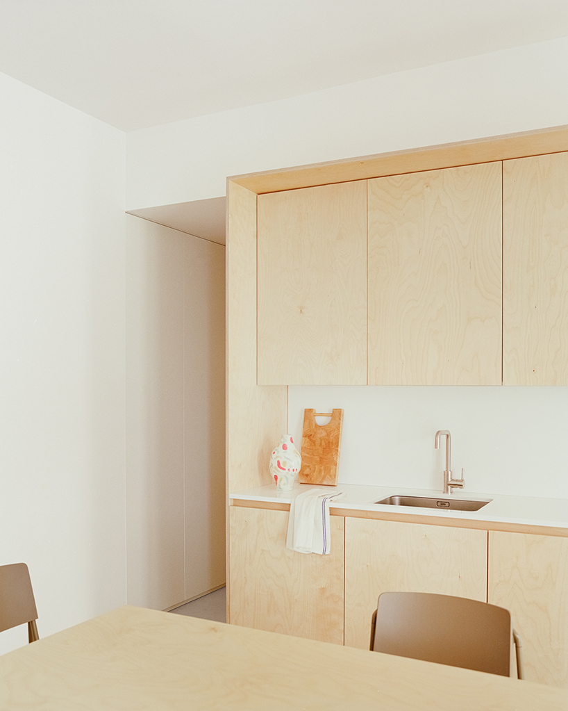 hybrid renovation by SET architects combines flexible living and working in milan